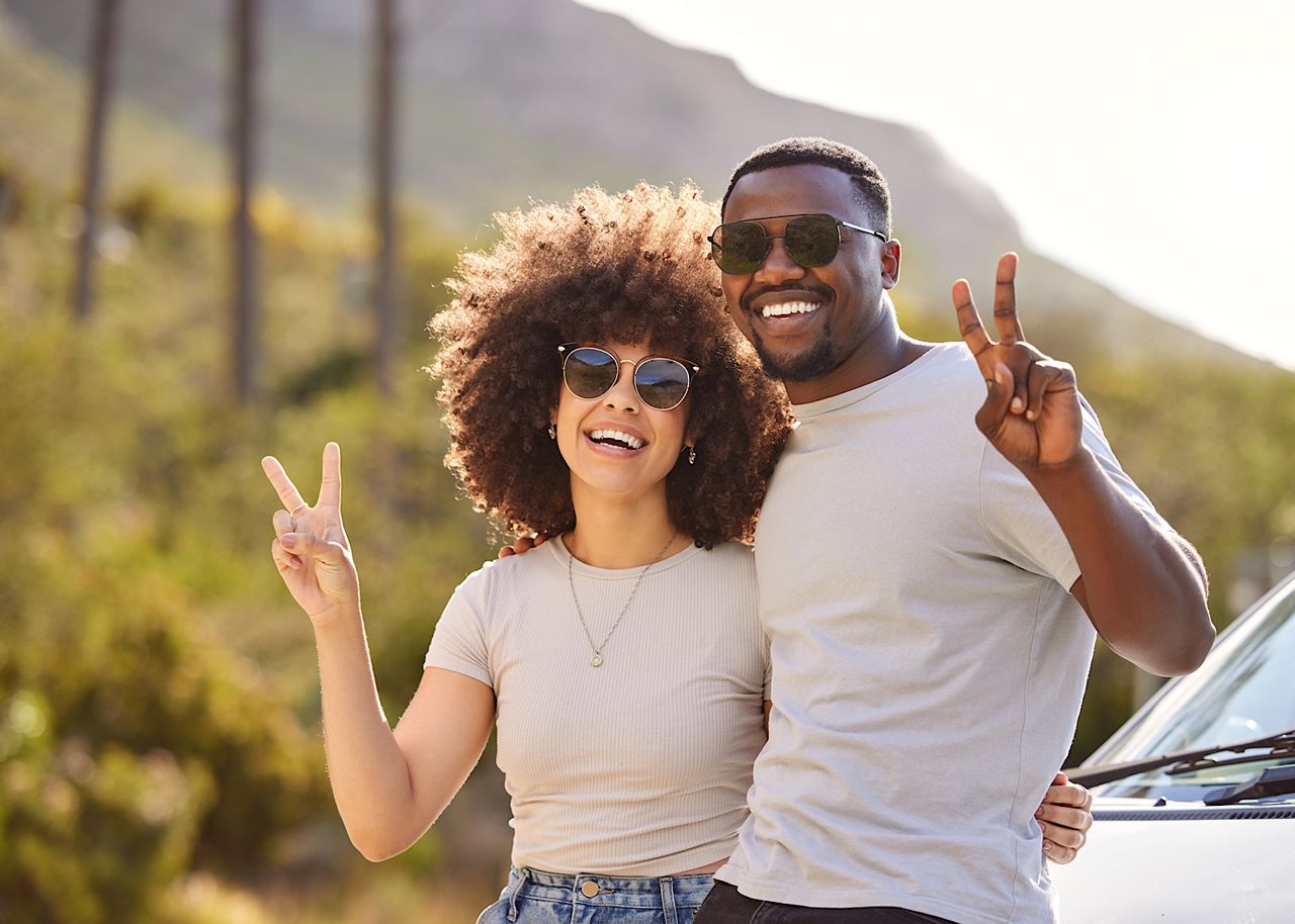 Creating memories together. Shot of a young couple out on a road trip. by YuriArcursPeopleimages