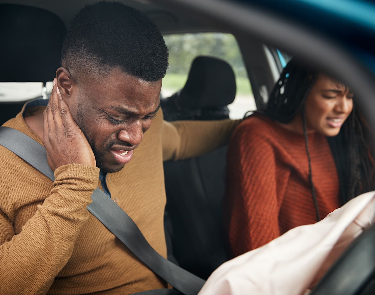 Couple Involved In Car Crash With Male Driver Suffering With Whiplash Injury by monkeybusiness
