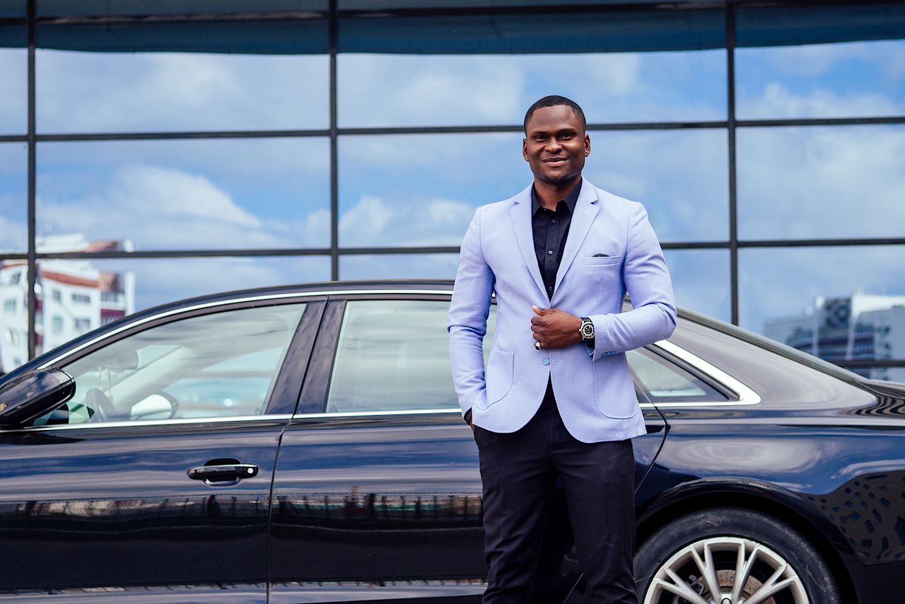 successful businessman handsome African American man in a stylish suit by yurakrasil